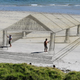 Illustration for article titled These 3D sand drawings create fun trippy illusions on the beach